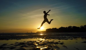 Sunset leaps on the black sand beach of Santa Catalina