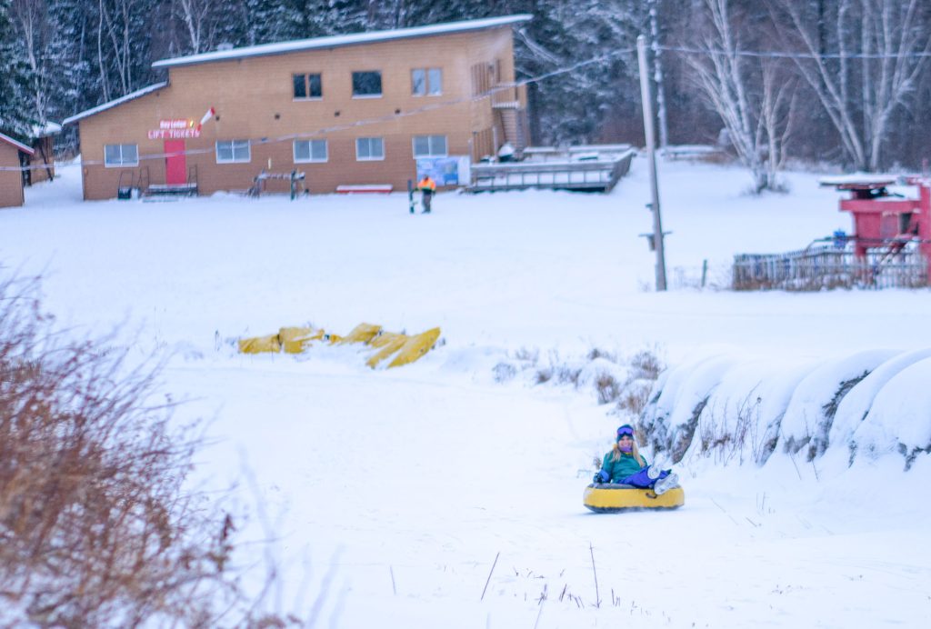 Tubing down a hill at Duck Mountain Ski Hill