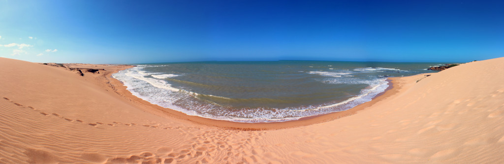 The view from the top of the 60m tall sand dunes down to the beautiful ocean.