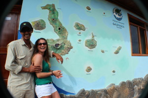Miguel and I in front of a painted map of the Galapagos Islands.