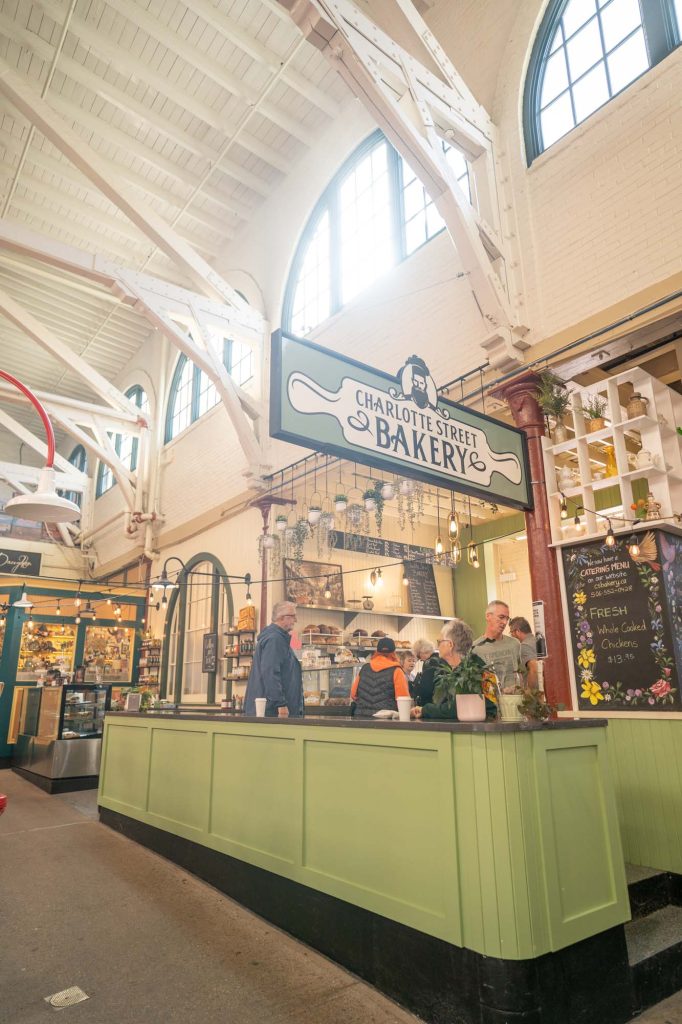 A green-countered bakery inside a marketplace.