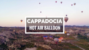 Dozens of hot air balloon over the landscape of Cappadocia, Turkey.